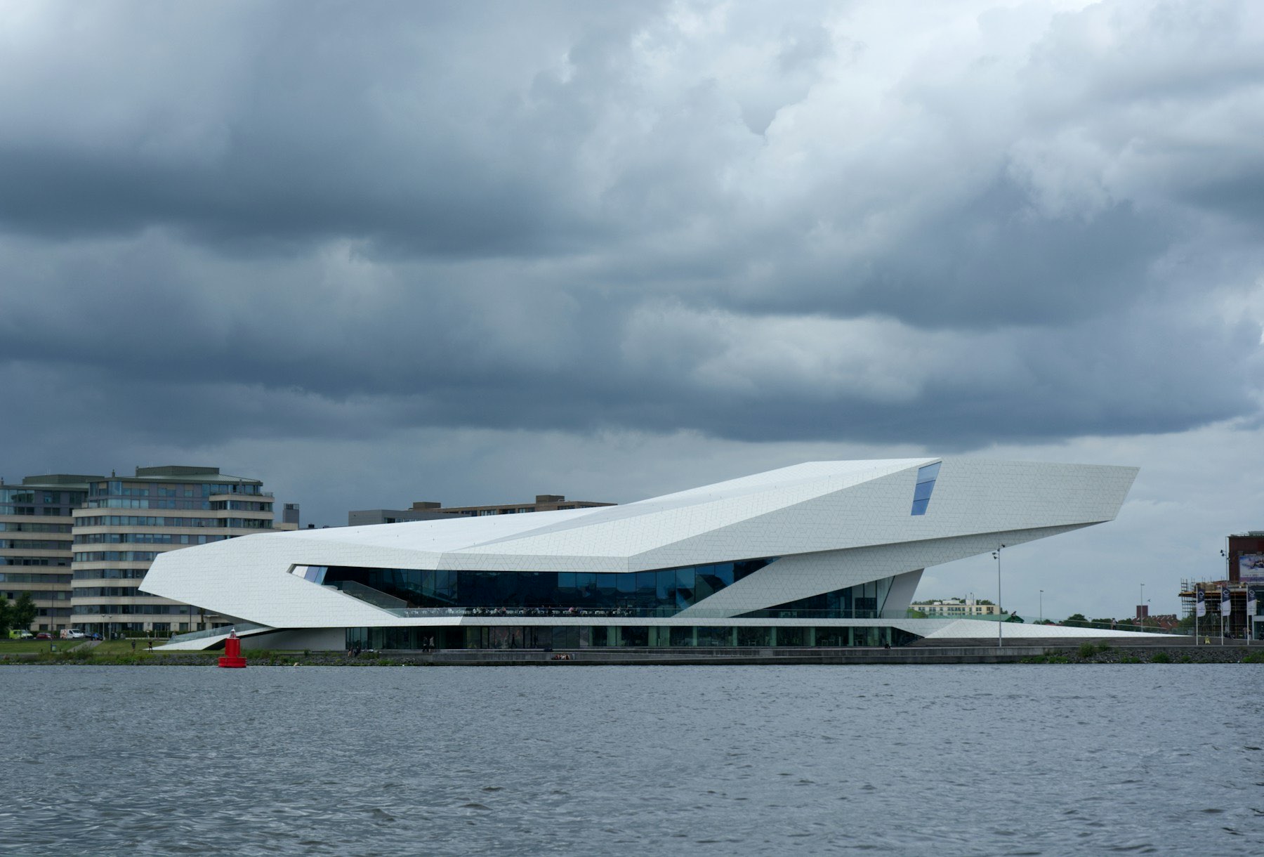 Eye Filmmuseum seen across the IJ under a heavy sky, Amsterdam